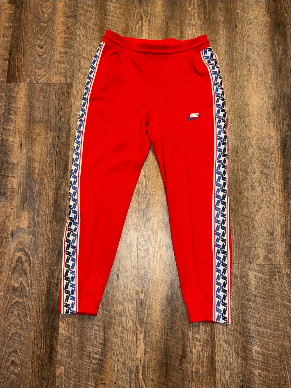 Nike Red Track Pants with Blue & White Logo Side Tape